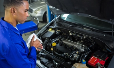 attentive-mechanic-servicing-car