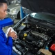 attentive-mechanic-servicing-car